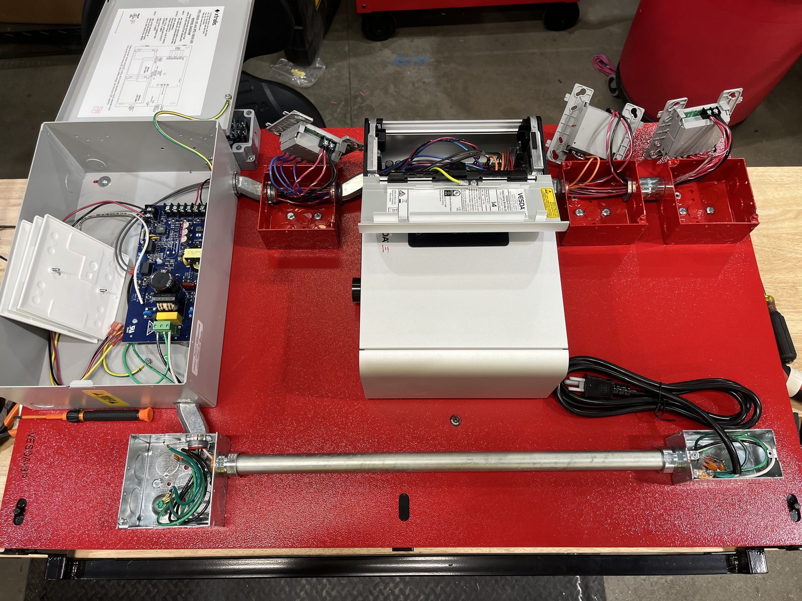 Completed VESDA panel assembly with control board enclosure, aspirating detector, and conduit
