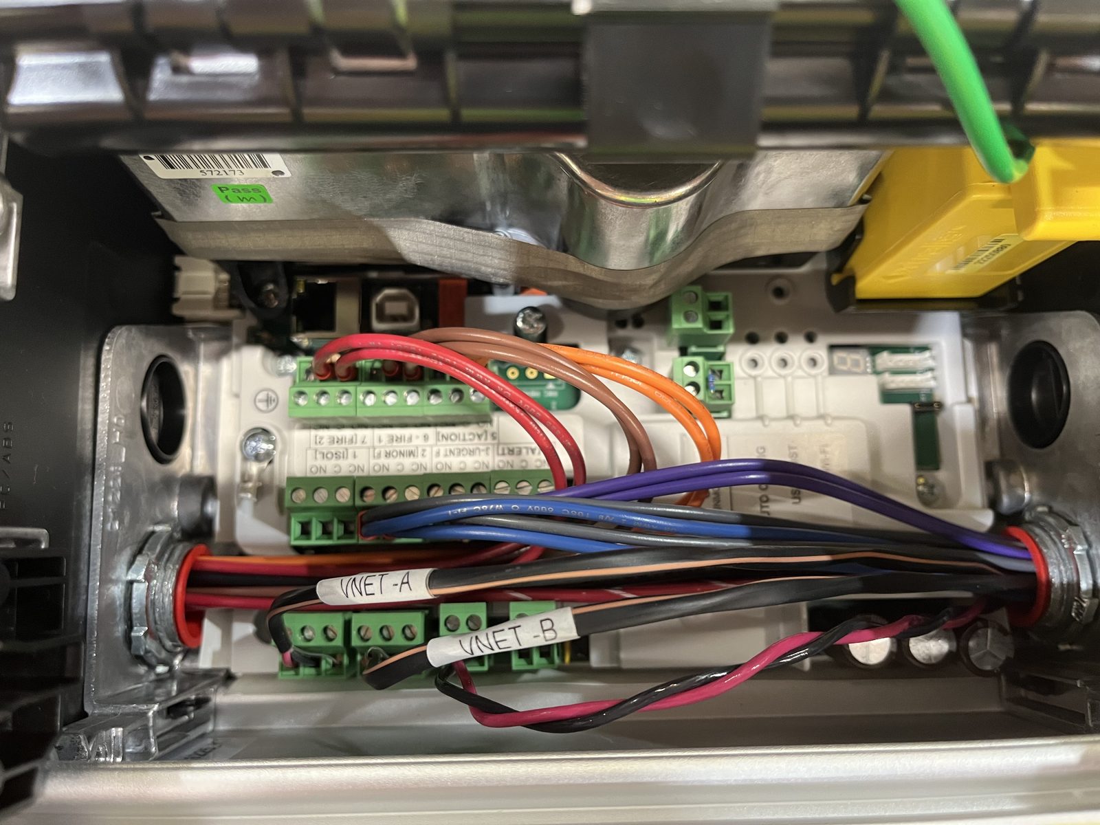 Close-up of VESDA internal terminal blocks with labeled VNET-A and VNET-B wiring